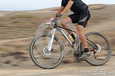 Motion blur of a mountain bike race Stock Photo