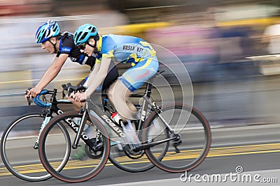 Motion blur panning shot of young bicycle racers Editorial Stock Photo