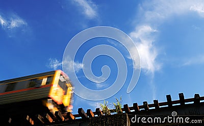 Motion blur train in the blue sky Stock Photo