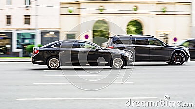 Motion blurred cars on the city highway. Road safety or reckless driving concept Editorial Stock Photo