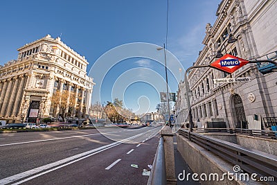 Motion blurred cars and people at Banco de Espana Central Bank subway station in Alcala street downtown Madrid Editorial Stock Photo