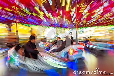 Motion Blurred Dodgems or Bumper Cars at a Fun Fair Stock Photo