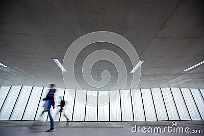 Figures in an underpassage getting to their workplace in the morning Stock Photo