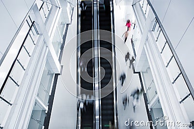 Motion blurred people on stairs Stock Photo