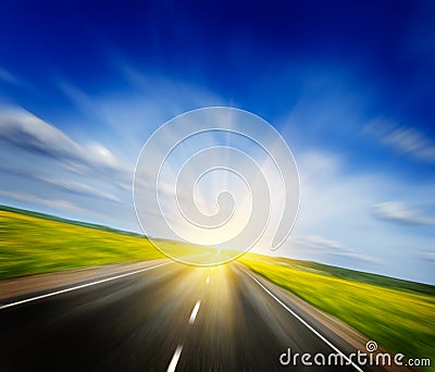 Motion blurred road in blooming spring meadow Stock Photo