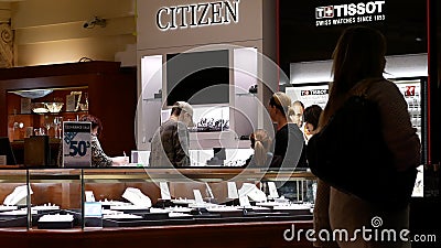 Motion of people shopping jewelry at jewelry store inside Coquitlam shopping mall stock footage Motion of people shopping jewelry at jewelry store inside Coquitlam shopping mall stock footage