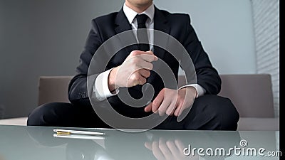 Motivated businessman clenching fists, confident of successful startup, winner Stock Photo