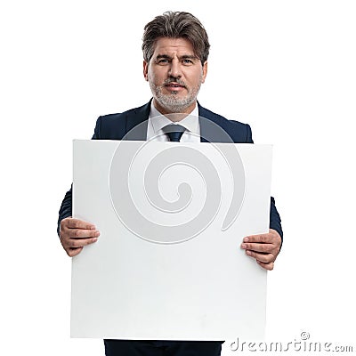 Motivated businessman holding a blank ad Stock Photo