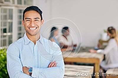 Motivated, confident and happy business man standing arms crossed in the boardroom for a meeting with his colleagues in Stock Photo