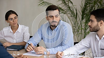 Motivated diverse employees brainstorm discuss ideas at meeting Stock Photo