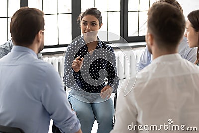 Motivated Indian female coach giving seminar or workshop Stock Photo