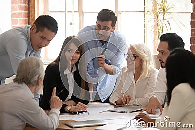 Motivated diverse businesspeople brainstorm at office meeting Stock Photo