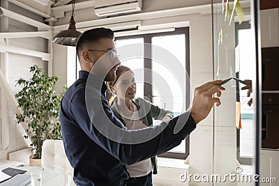 Motivated multiracial colleagues engaged in creative thinking Stock Photo