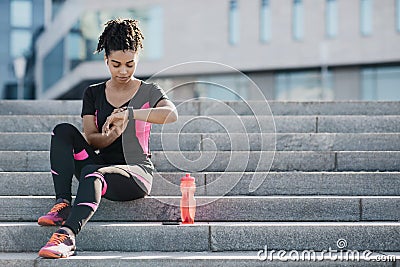 Motivated woman training outside under covid-19 health crisis Stock Photo