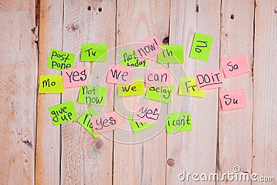 Motivating phrases like Now, can do it, Yes, on sticky notes Stock Photo