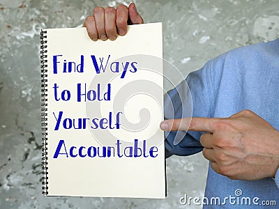 Motivation concept meaning Find Ways to Hold Yourself Accountable with inscription on the piece of paper Stock Photo