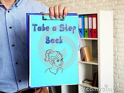 Motivation concept meaning Take a Step Back with sign on the piece of paper Stock Photo