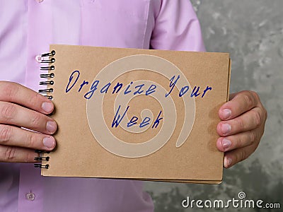 Motivational concept about Organize Your Week with sign on the page Stock Photo