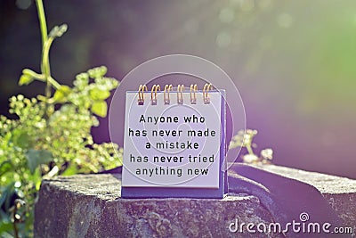 Motivational and inspirational quote with phrase - Anyone who has never made a mistake has never tried anything new Stock Photo