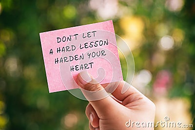 Life Motivational and inspirational quotes - Don`t let a hard lesson harden your heart Stock Photo