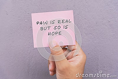 Life Motivational and inspirational quotes - pain is real but so is hope Stock Photo