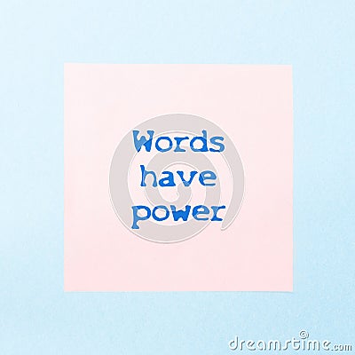 Motivational quote on a pink sticker words have power. Stock Photo