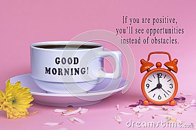 Motivational quote with white coffee cup with alarm clock set at 8 o'clock. Stock Photo