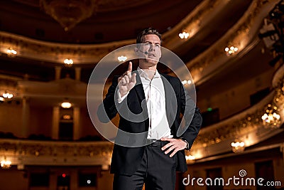 Motivational Speaker In Formal Elegant Suit, Talking about Happiness, Self, Success Stock Photo