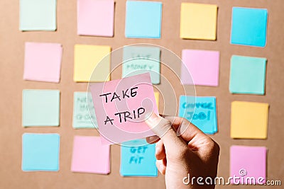 Motivational word `Take a trip ` on pink card Stock Photo