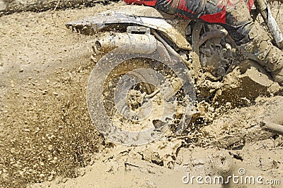 Motocross accelerating speed in mud Stock Photo