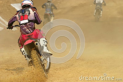 Motocross bike increase speed in track Stock Photo