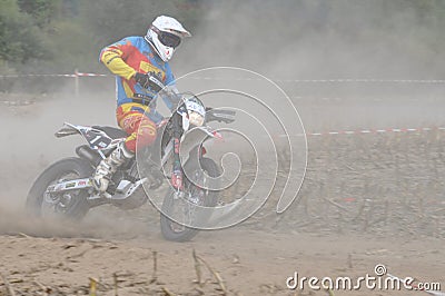 Motocross driver in dust Editorial Stock Photo