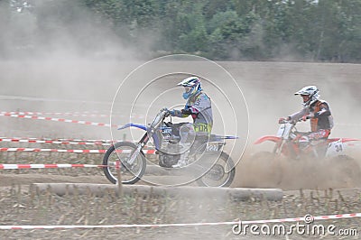 Motocross drivers in dust Editorial Stock Photo