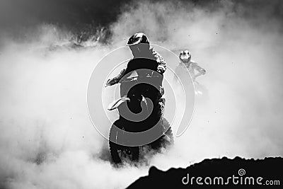 Motocross racer accelerating in dust track Editorial Stock Photo