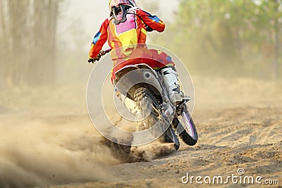 Motocross racer accelerating speed in track Stock Photo