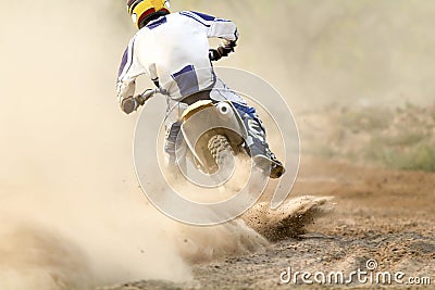 Motocross racer accelerating speed in track Stock Photo