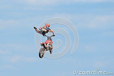 Motocross racer performs a jump Editorial Stock Photo