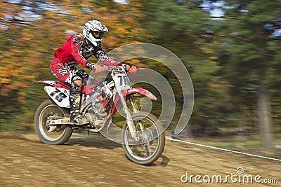 Motocross racer in red id riding Editorial Stock Photo