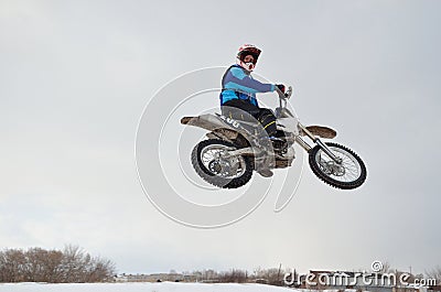 Motocross rider jump look back Stock Photo