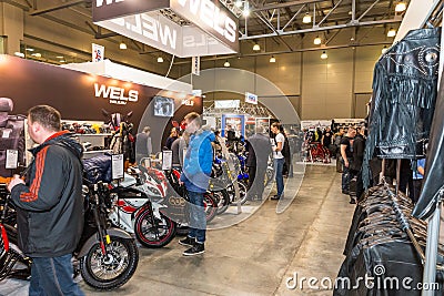 Motopark-2015 (BikePark-2015). The exhibition stand of Wels. Customers visiting the exhibition stand. Editorial Stock Photo