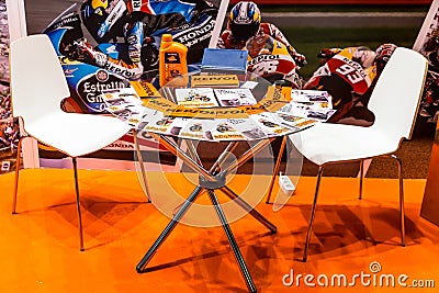 Motopark-2015 (BikePark-2015). Table with brochures near the exhibition stand. Editorial Stock Photo