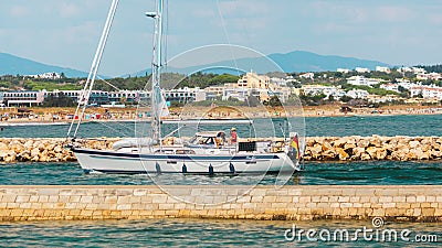 Motor boat entering the harbour in Lagos, Portugal Editorial Stock Photo
