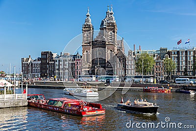 Motor boat with tourists at a canal cruise in Amsterdam Editorial Stock Photo