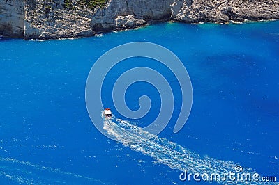 Blue water background. Motor boating on azure water, Ionian Sea - Zakynthos Island, landmark attraction in Greece. Seascape Stock Photo