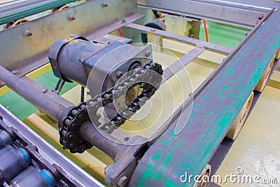 Motor chain drive shaft in conveyor line Stock Photo