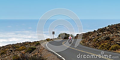 Motor cyclist above the clouds Editorial Stock Photo