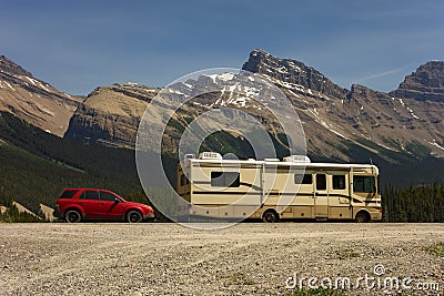 A motor home and dinghy at a national park in alberta Editorial Stock Photo