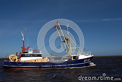 Motor sailor on the Wadden Sea between Schiermonnikoog and Lauwersoog on the mainland Editorial Stock Photo