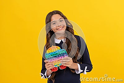 motor skills. pop it fun. cheerful child presenting color popit fidget. push button antistress toy Stock Photo