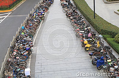 Motorbike and bicycle street parking Shanghai China Editorial Stock Photo